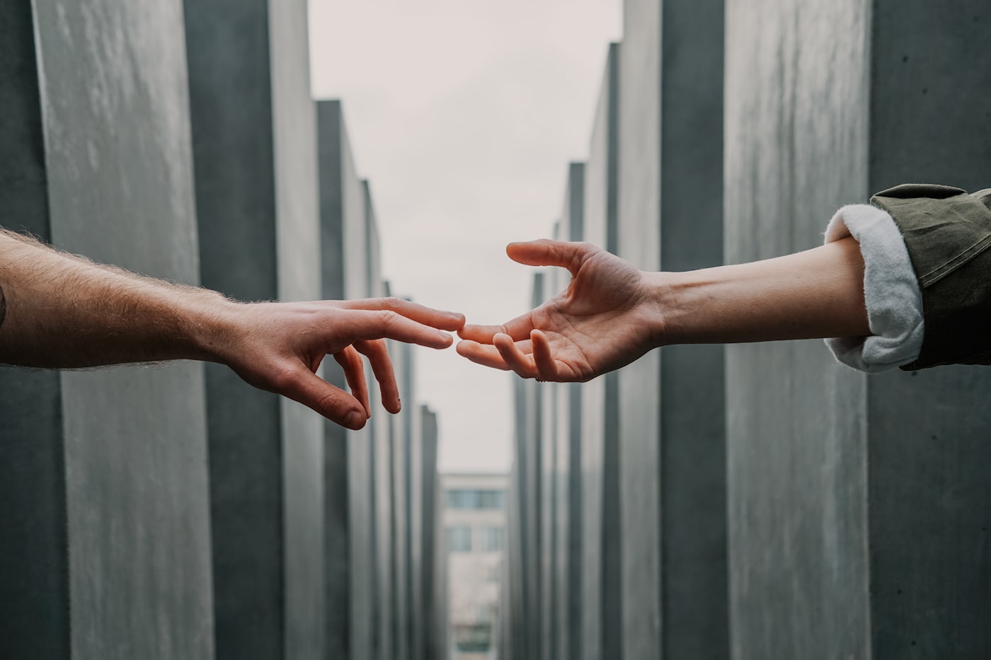 Hands passing a donation envelope